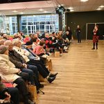 Salle remplie de participants à un colloque